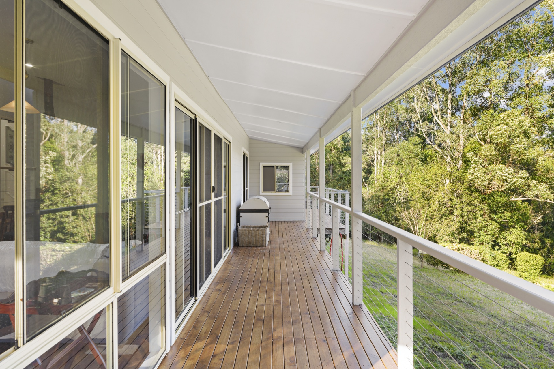 Wraparound balcony walkway with forest views